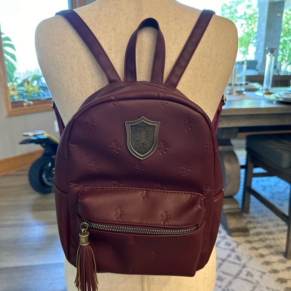 Harry Potter World Handbags - Harry Potter world burgundy Griffindor 11” backpack unused condition